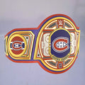 Close-up of the Montreal Canadiens WWE Championship Belt, showcasing red, white, and blue accents.