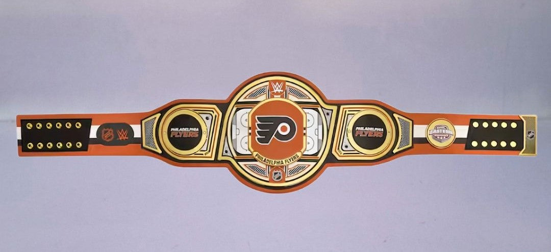 Detailed view of the Philadelphia Flyers WWE Championship Belt, featuring embossed logos and a sleek finish.