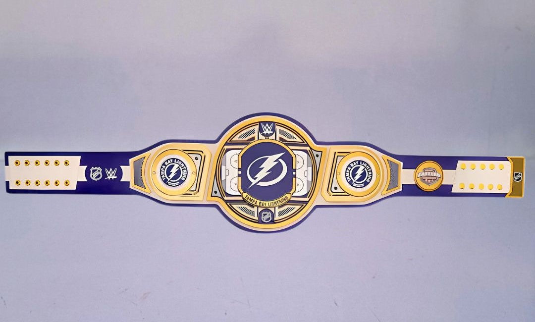 Detailed view of the Tampa Bay Lightning WWE Championship Belt, featuring embossed logos and a polished finish.